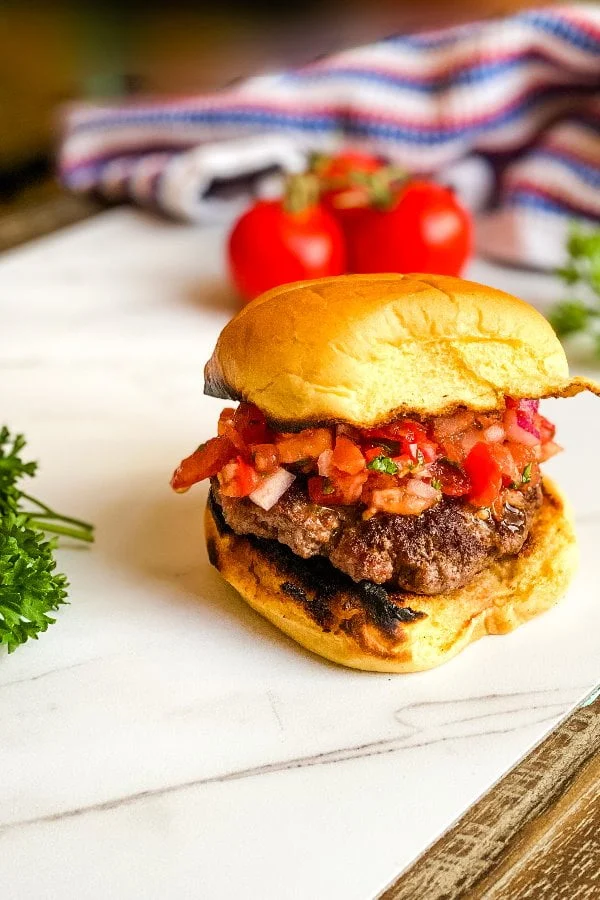 burgers on a bun with tomato relish