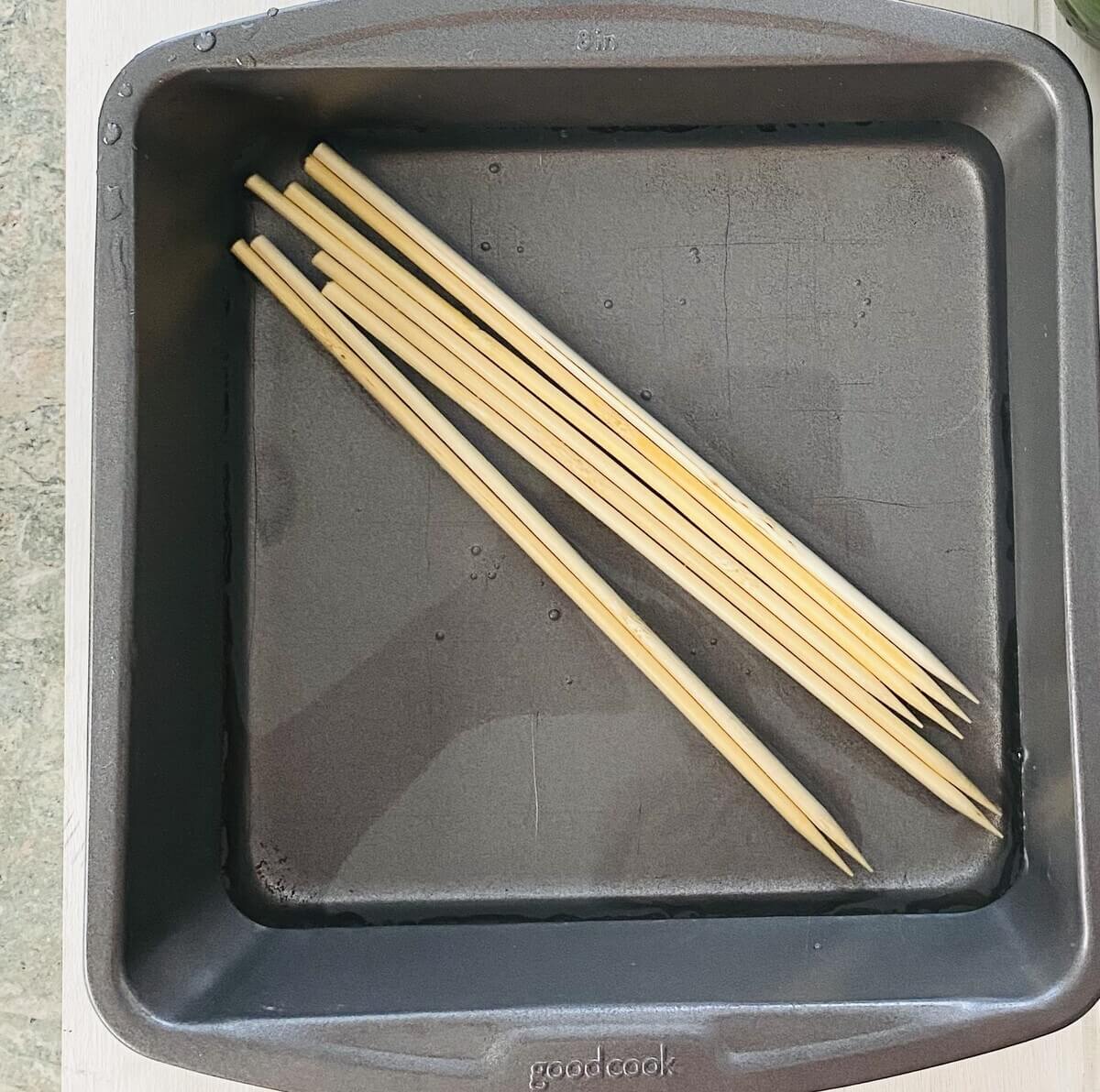 soaking wooden skewers in cold water.