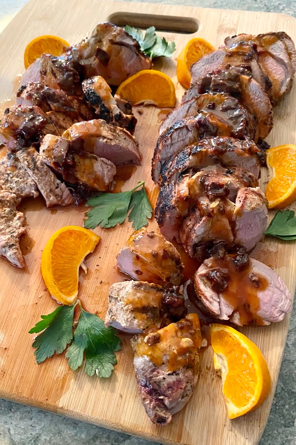Grilled pork tenderloin with a spicy chipotle honey orange sauce.