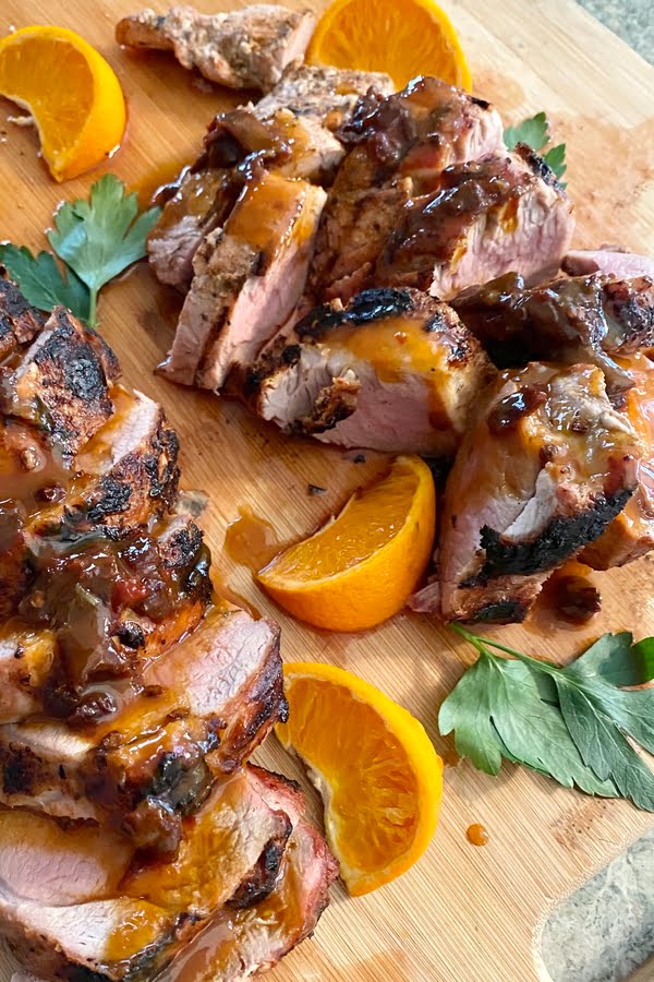 Tenderloin with a sweet and spicy chipotle, honey and orange drizzle and orange segments.