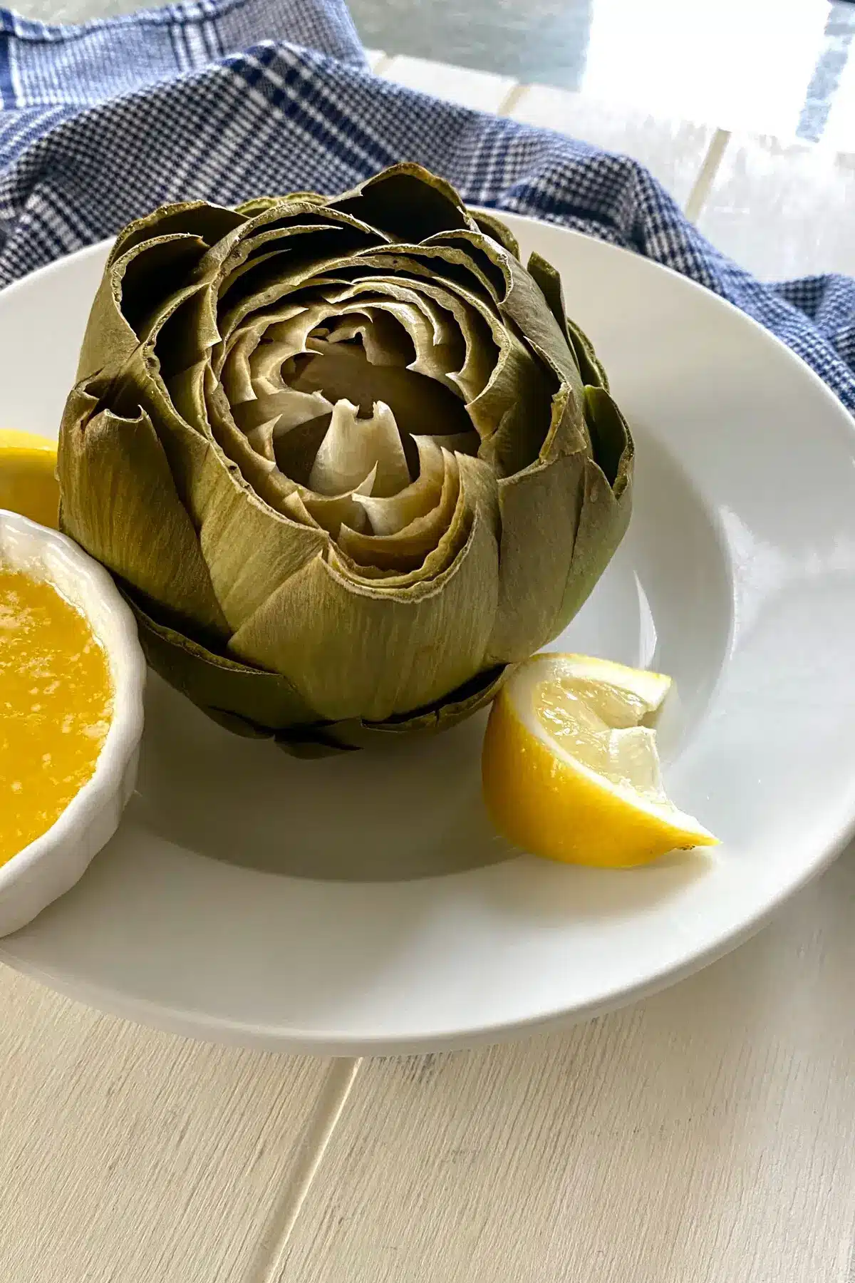 cooked artichoke with melted butter.