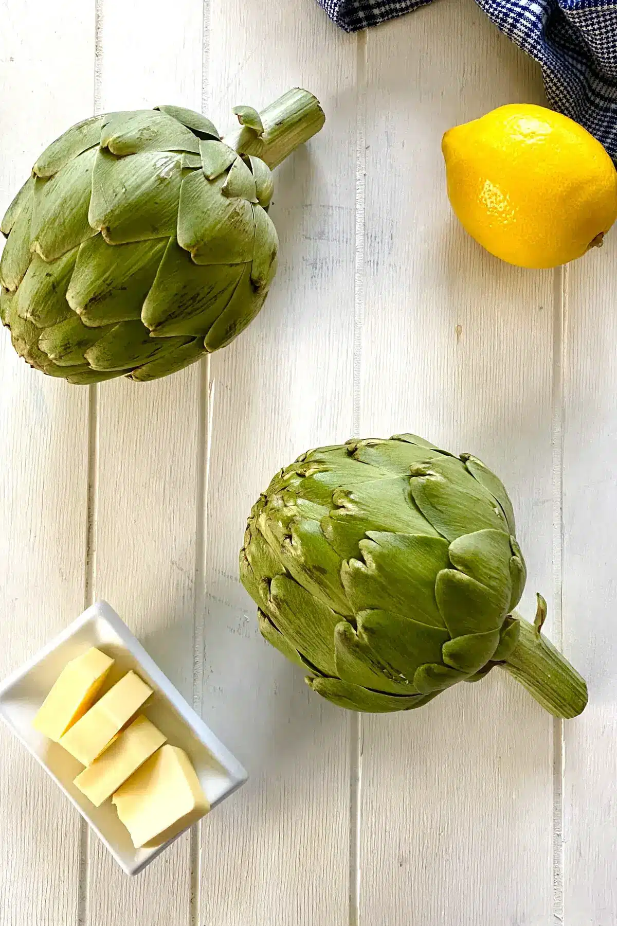 2 artichokes, butter and a lemon.