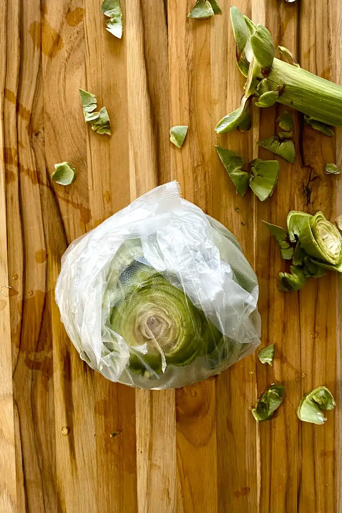 plastic wrapped artichoke.