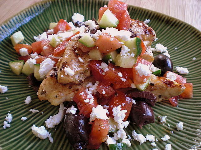 Grilled chicken topped with a salsa of tomatoes, olives and cucumbers.