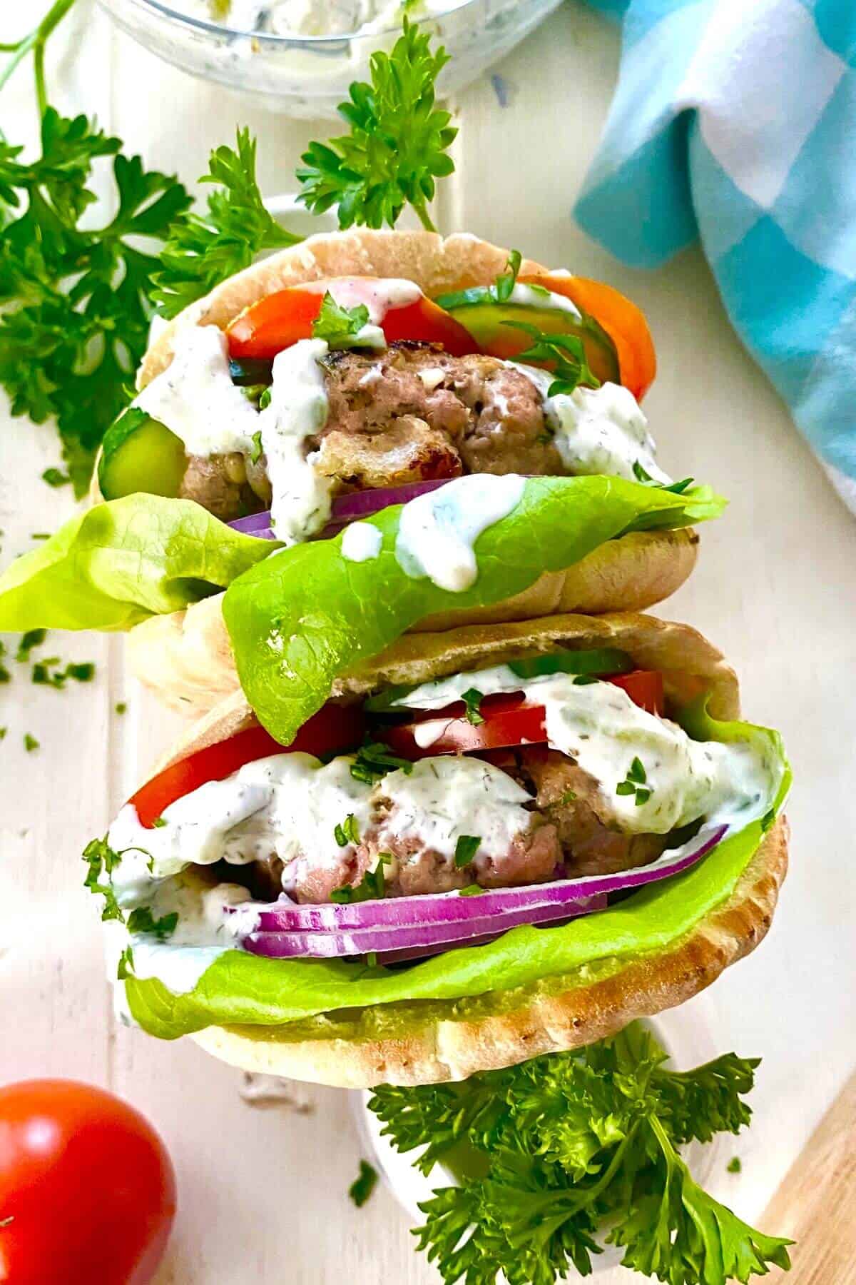 2 Greek turkey burgers in pitas.