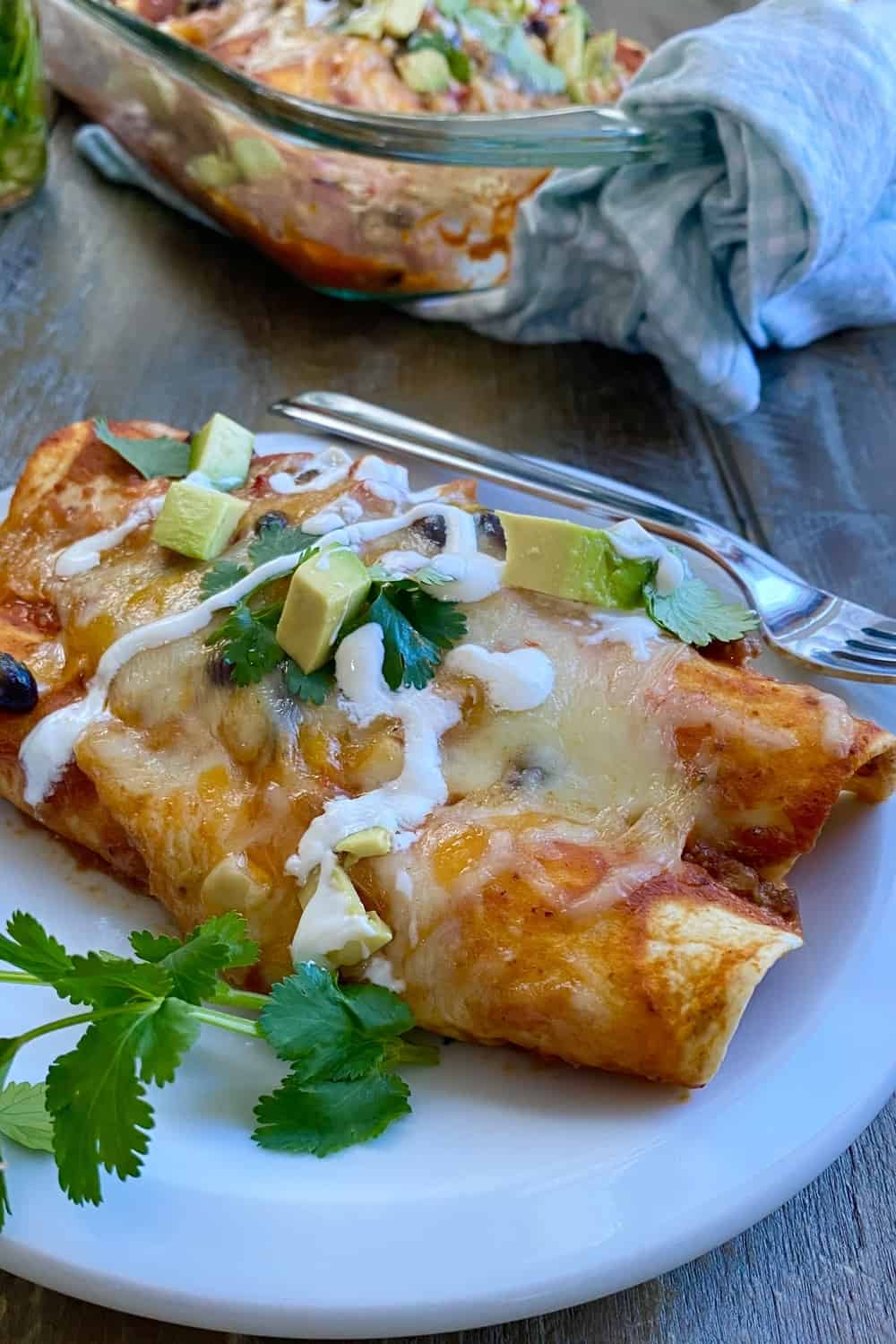2 veggie and bean filled enchiladas