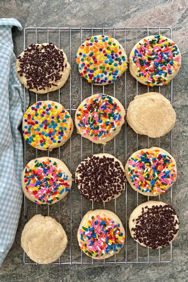 1 dozen sugar cookies with a variety of sprinkles