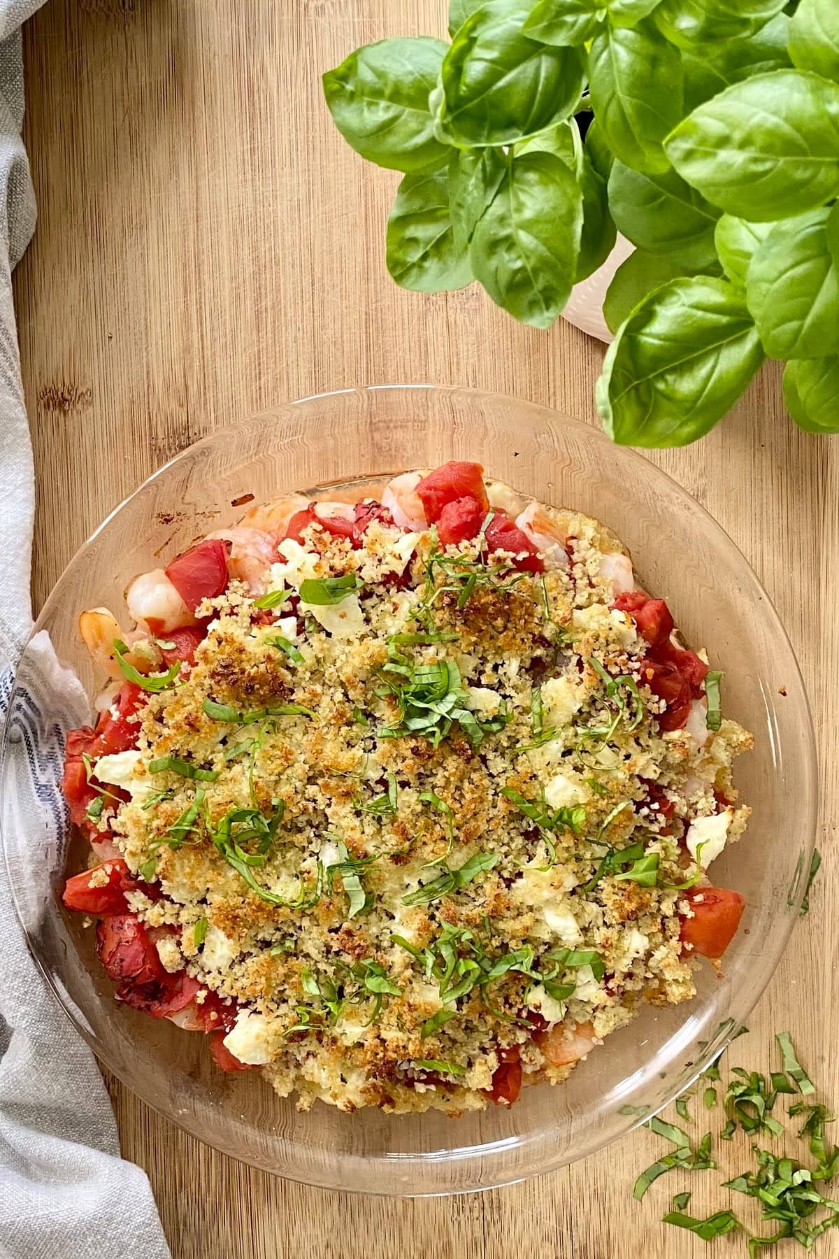 baked shrimp with feta and tomatoes topped with basil