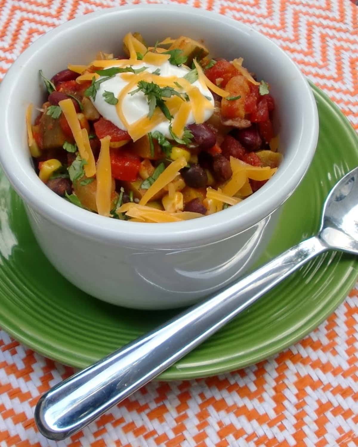 A bowl of vegetable chili with beans.