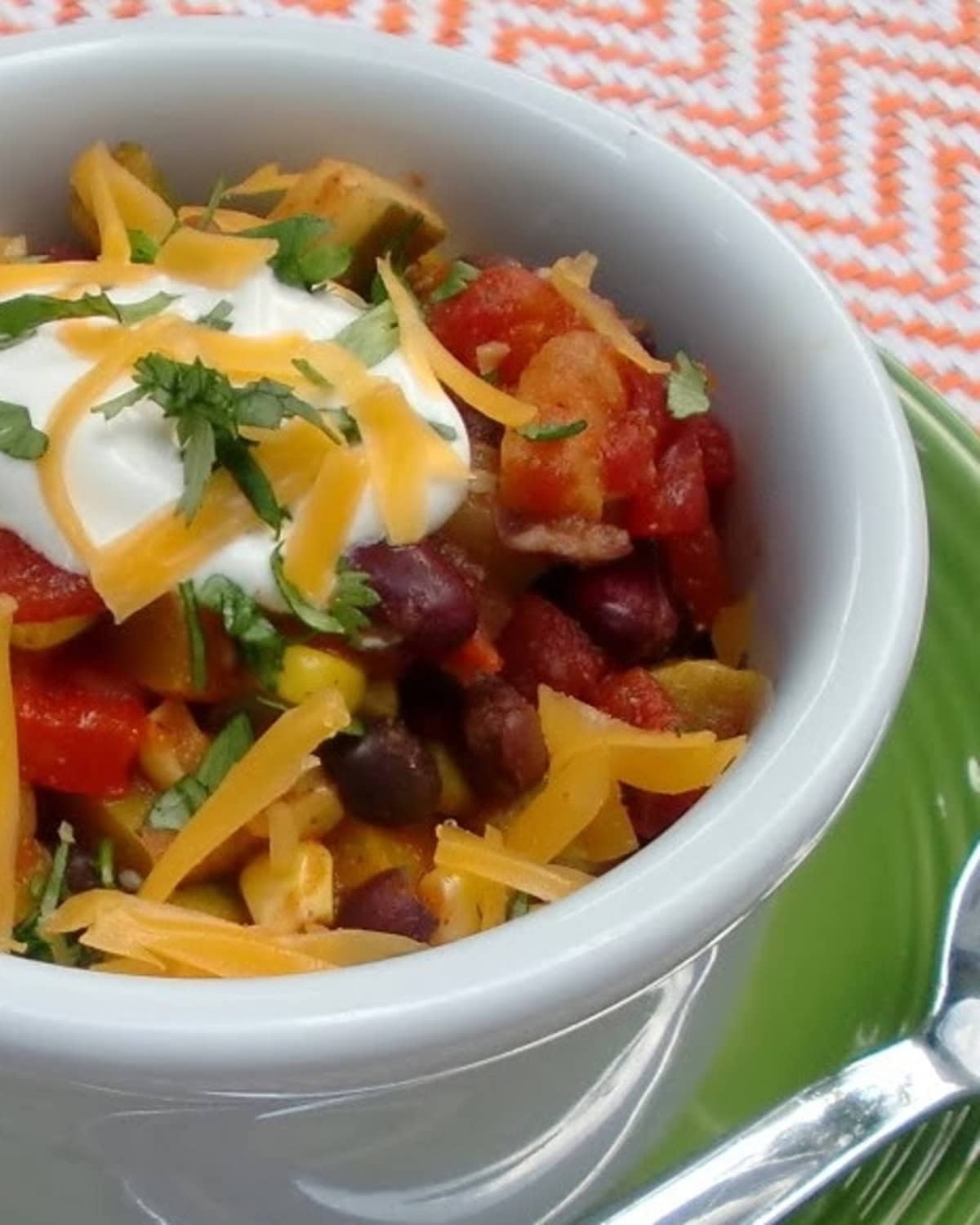 A close up of chili made with vegetables.