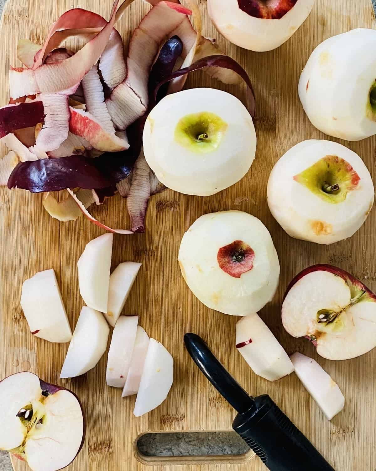 peeled whole apples and apple peels