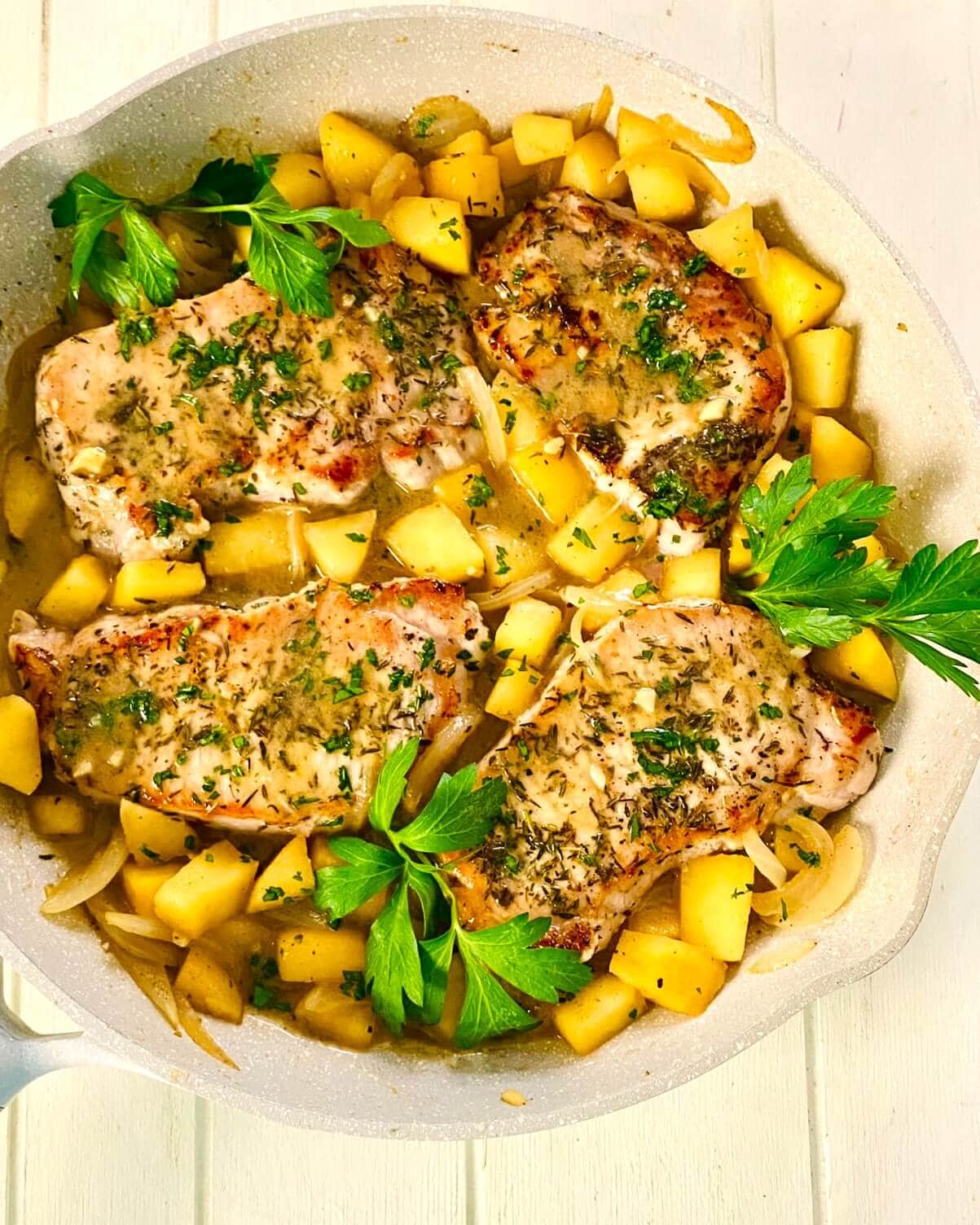 adding pork chops with apples and onions.
