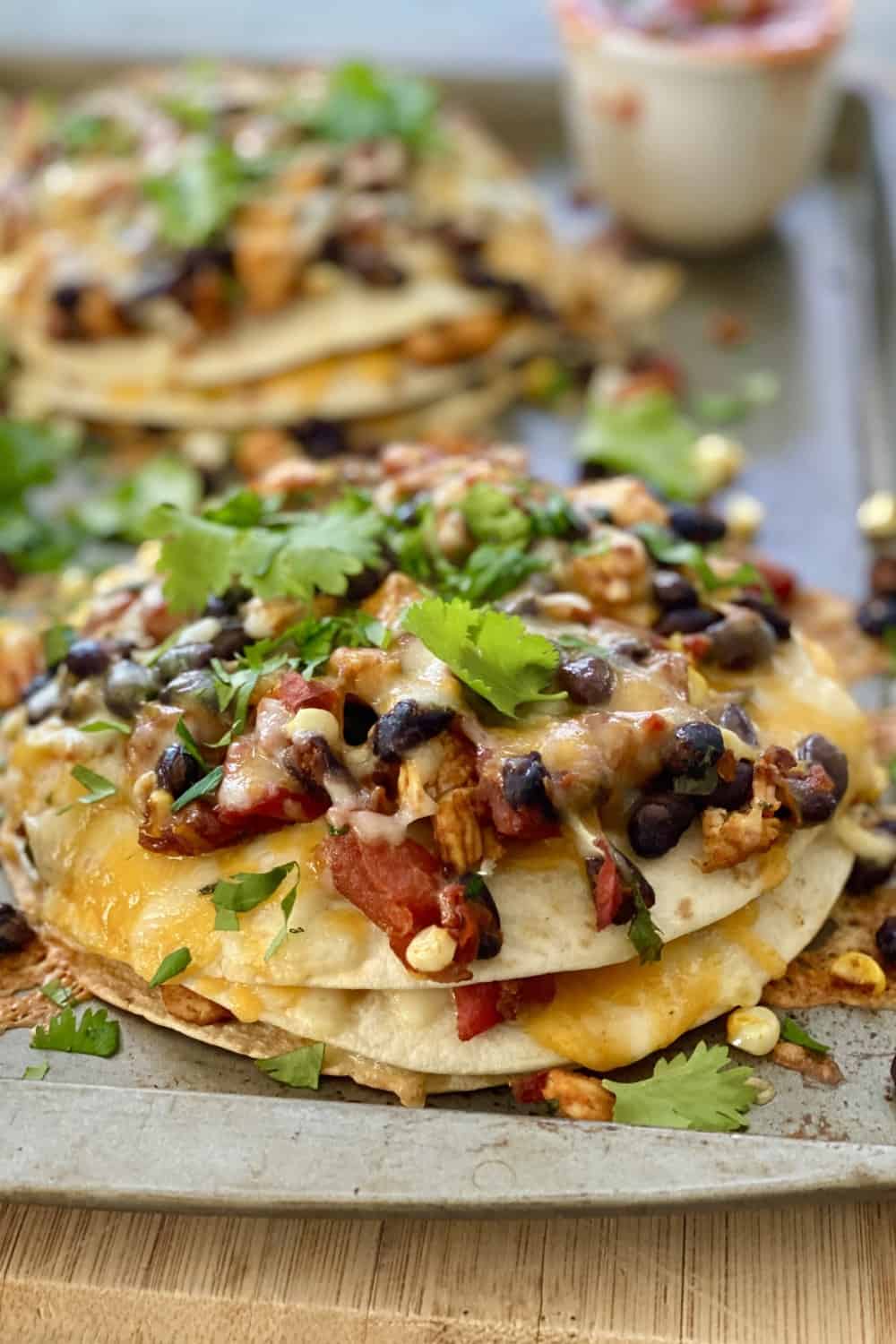 tortillas stacks with chicken, beans and corn