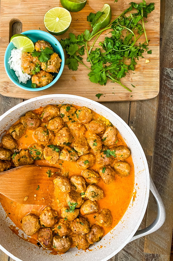 pan of Thai meatball curry with fresh cilantro