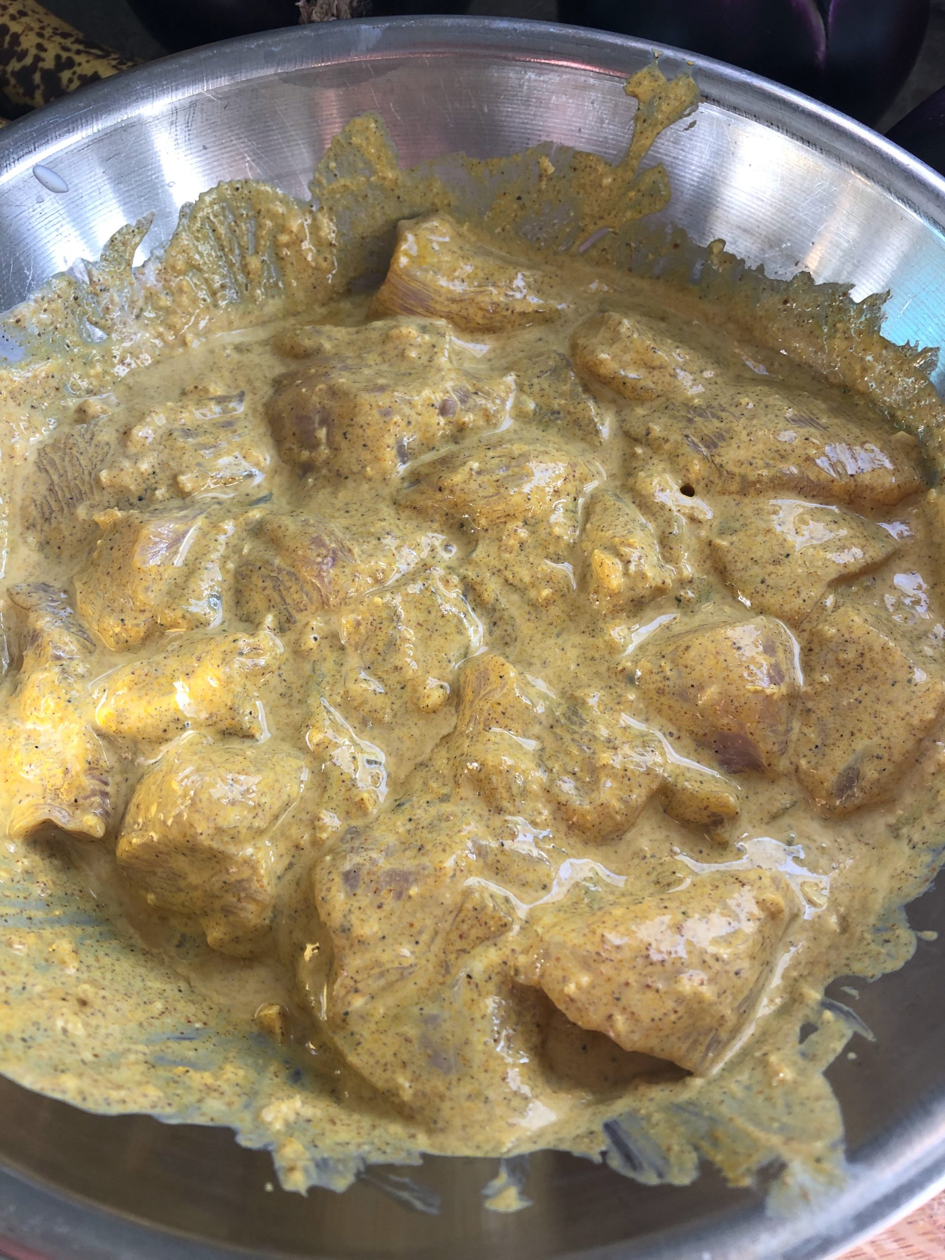 Marinating chicken in yogurt for butter chicken.