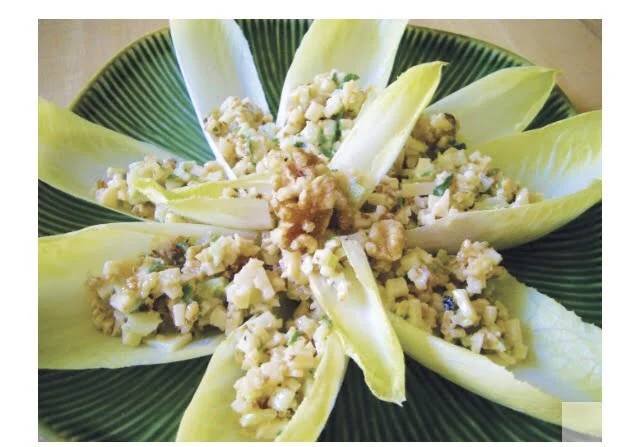 Endive leaves stuffed with parmesan and walnuts.