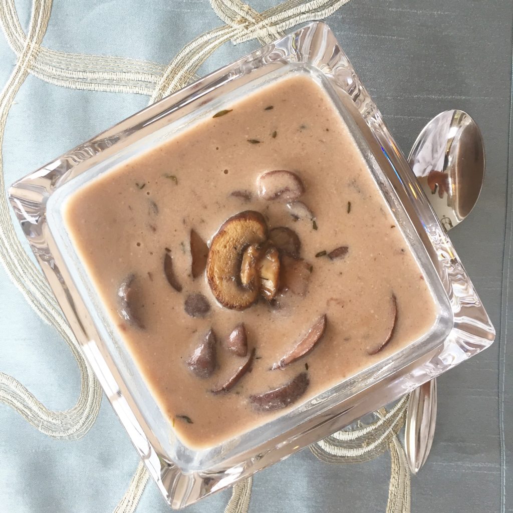 square glass bowl containing cream of mushroom soup