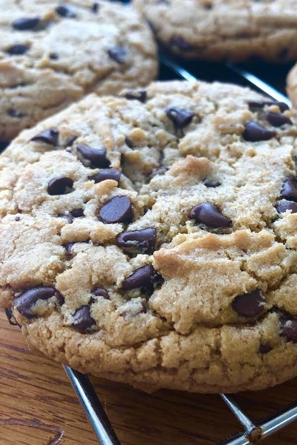 a large cookie made with almond butter and mini chocolate chips