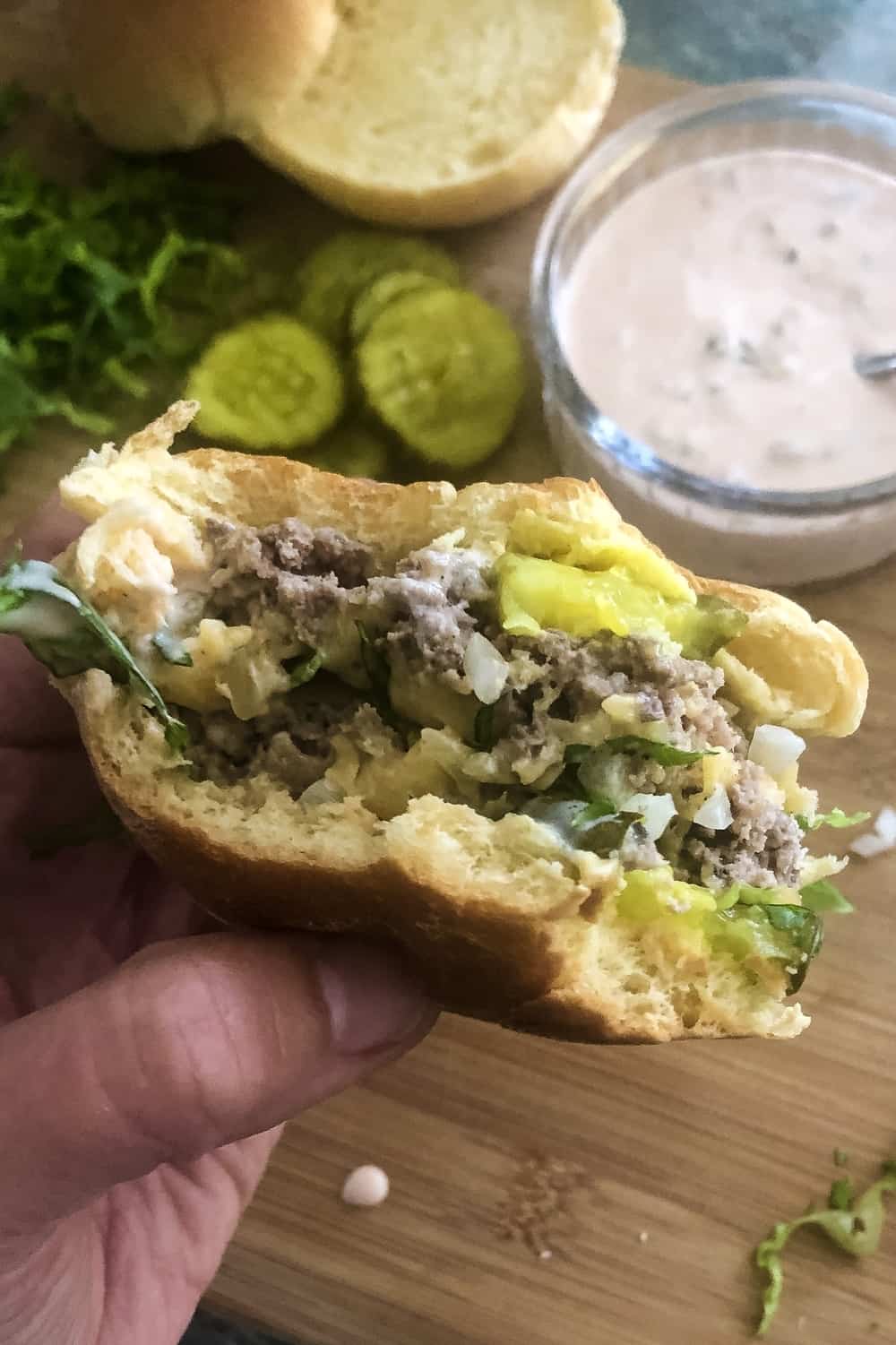 Big Mac slider with 2 bites out of it