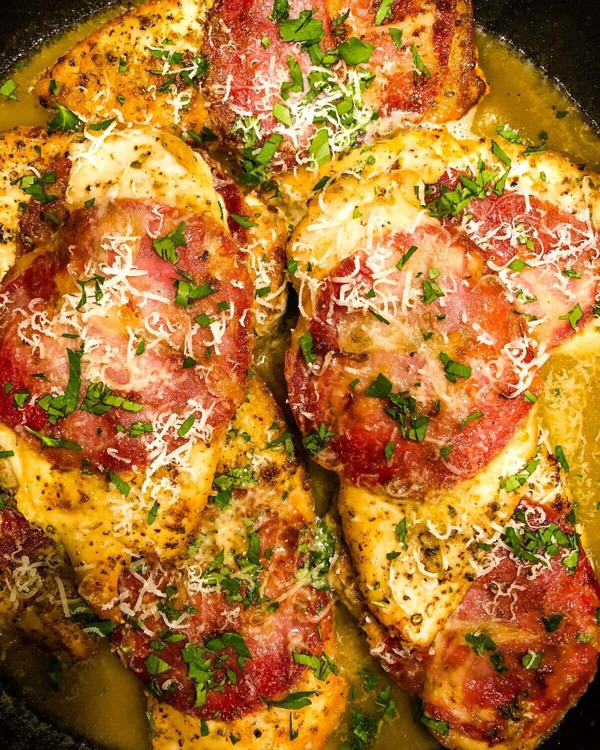chicken in wine sauce in a pan.