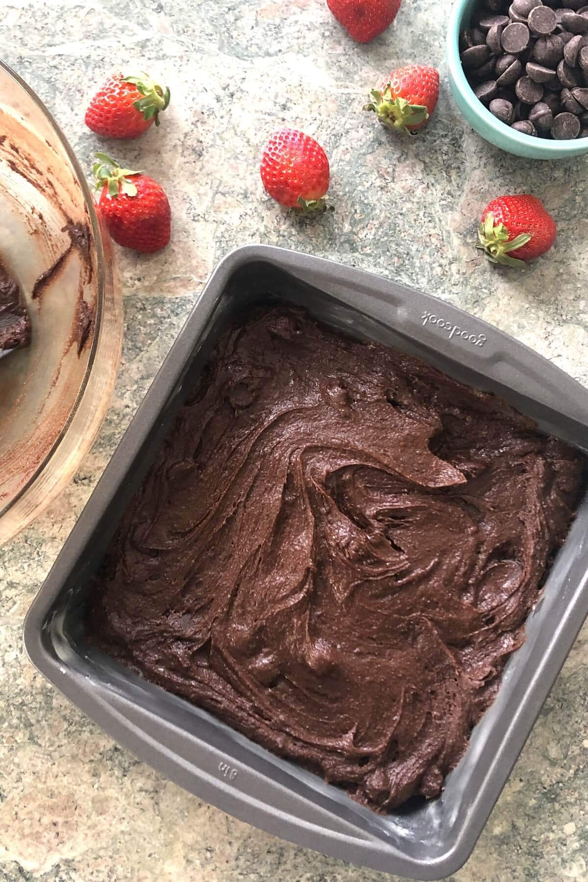 Brownie batter in a pan.