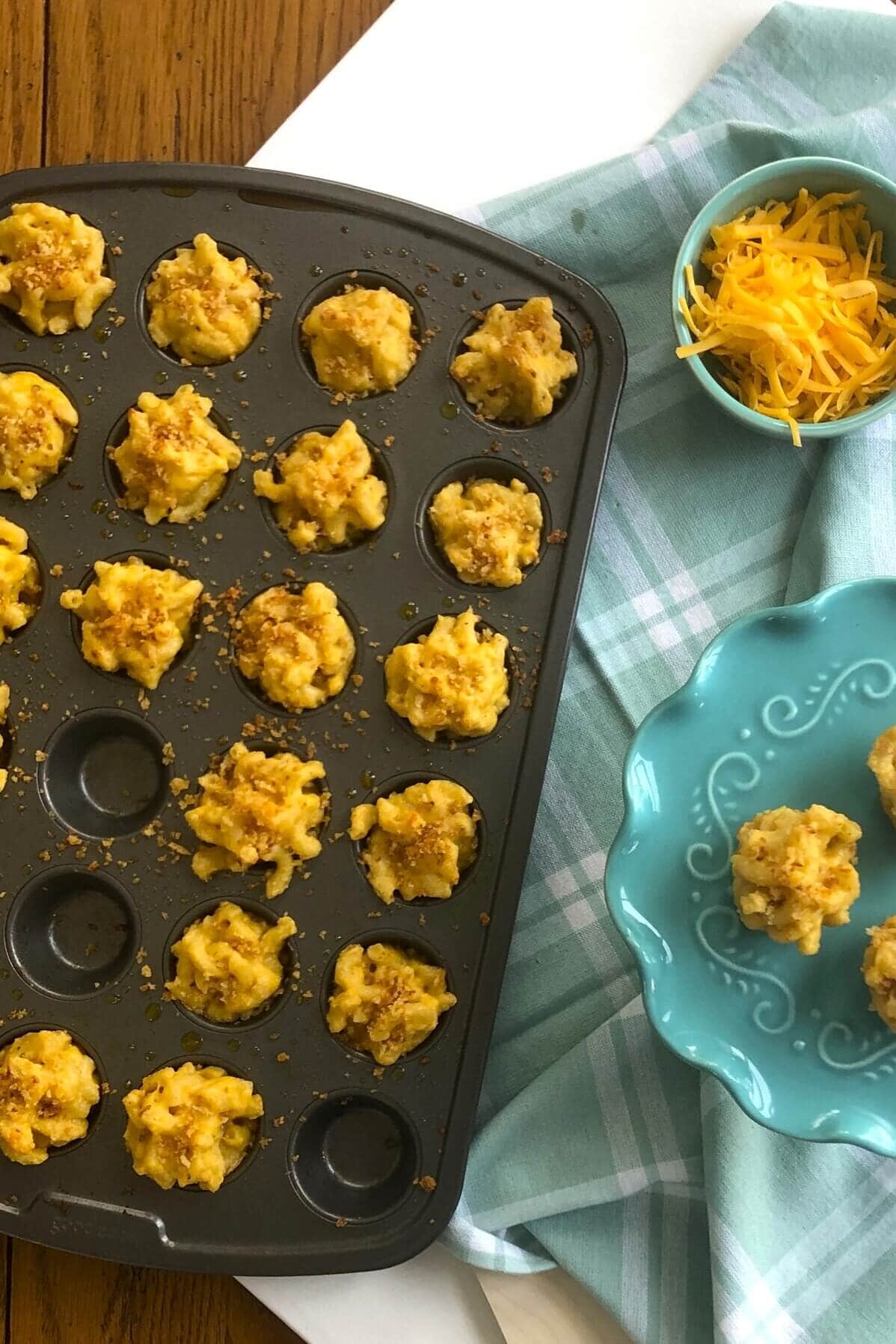 Macaroni and cheese bites in a mini muffin pan.