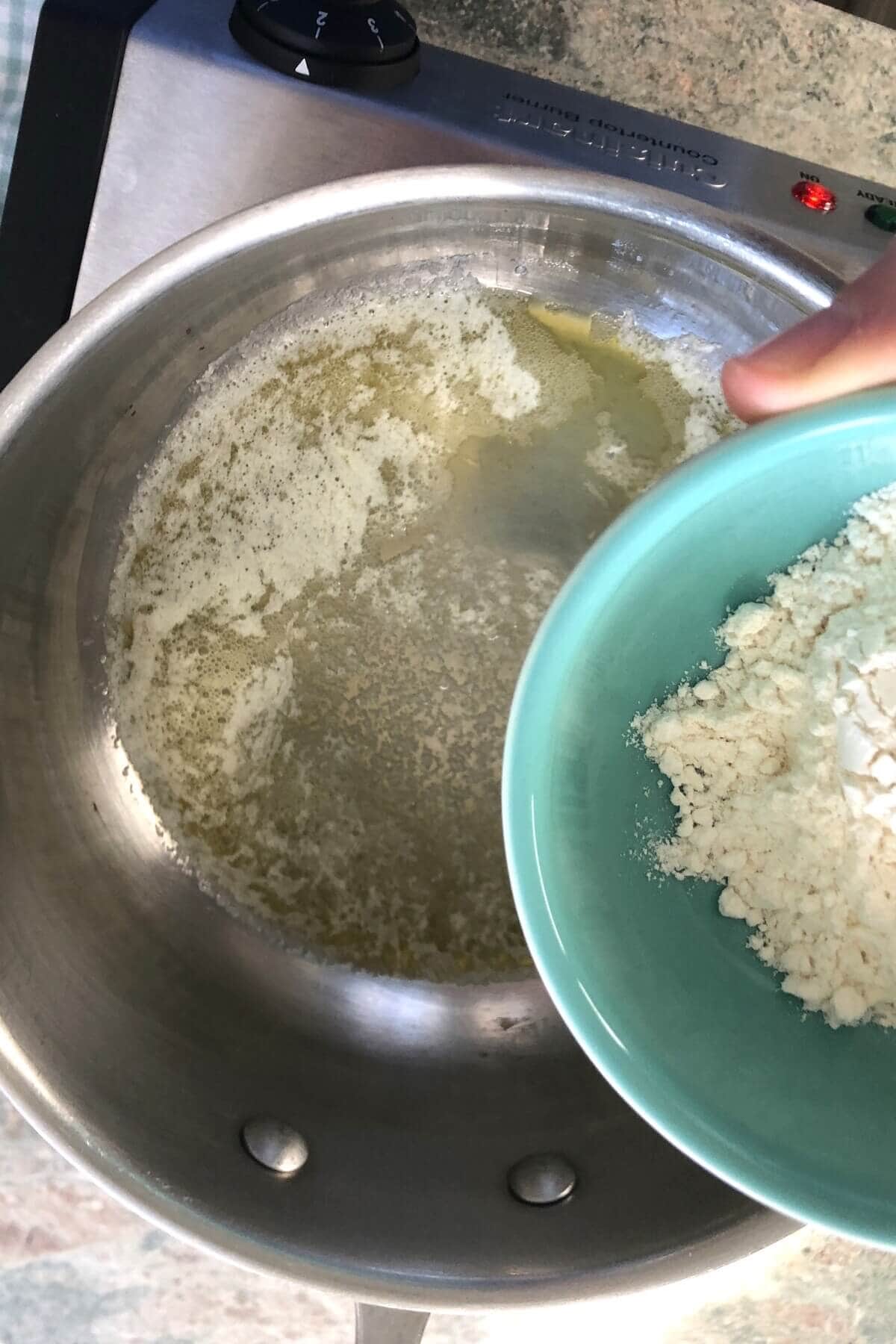 making a roux with melted butter and flour.