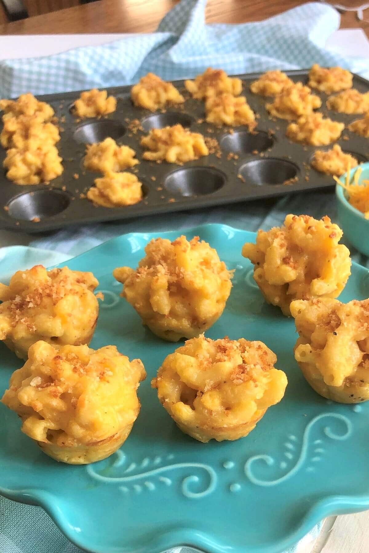 teal plate with macaroni and cheese bites.