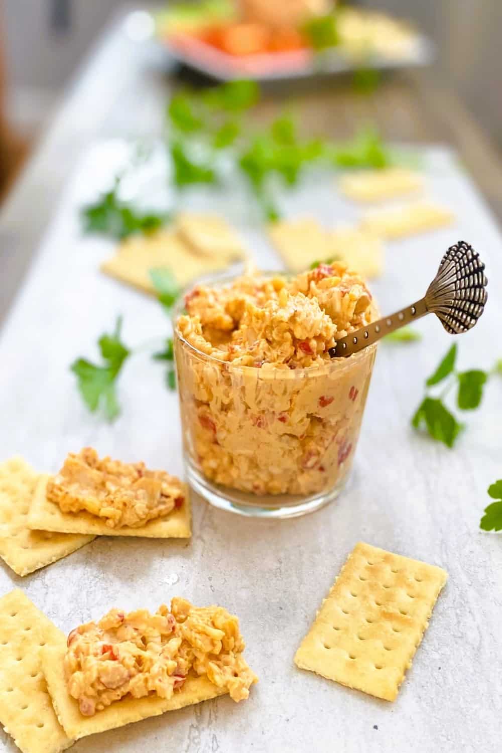jar of pimento cheese with crackers