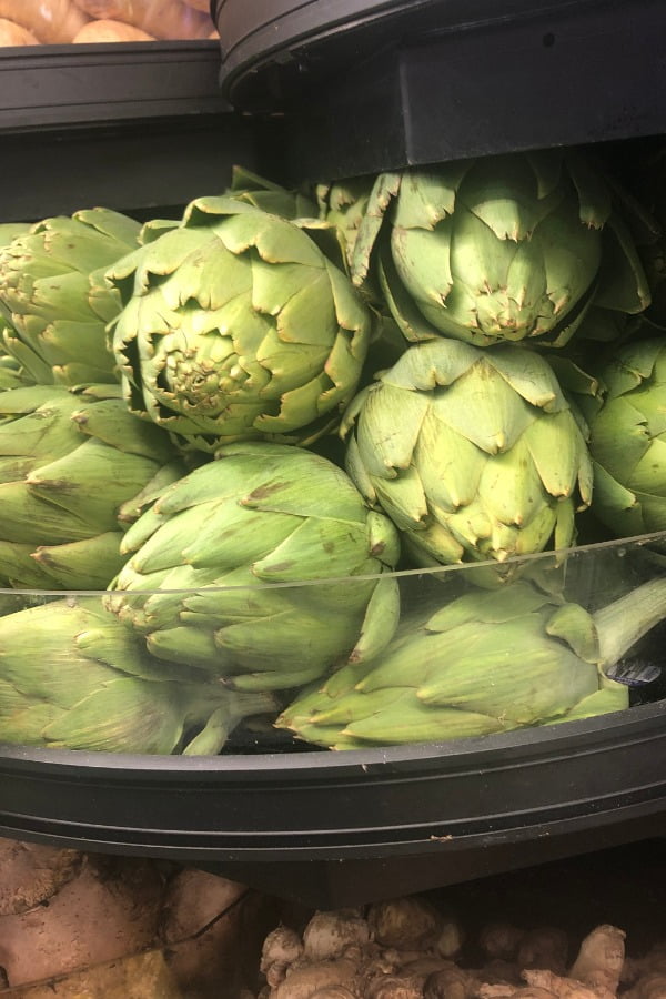 bin or artichokes at grocery store
