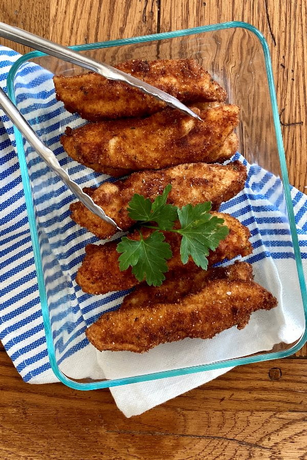 glass storage dish with chicken fingers.