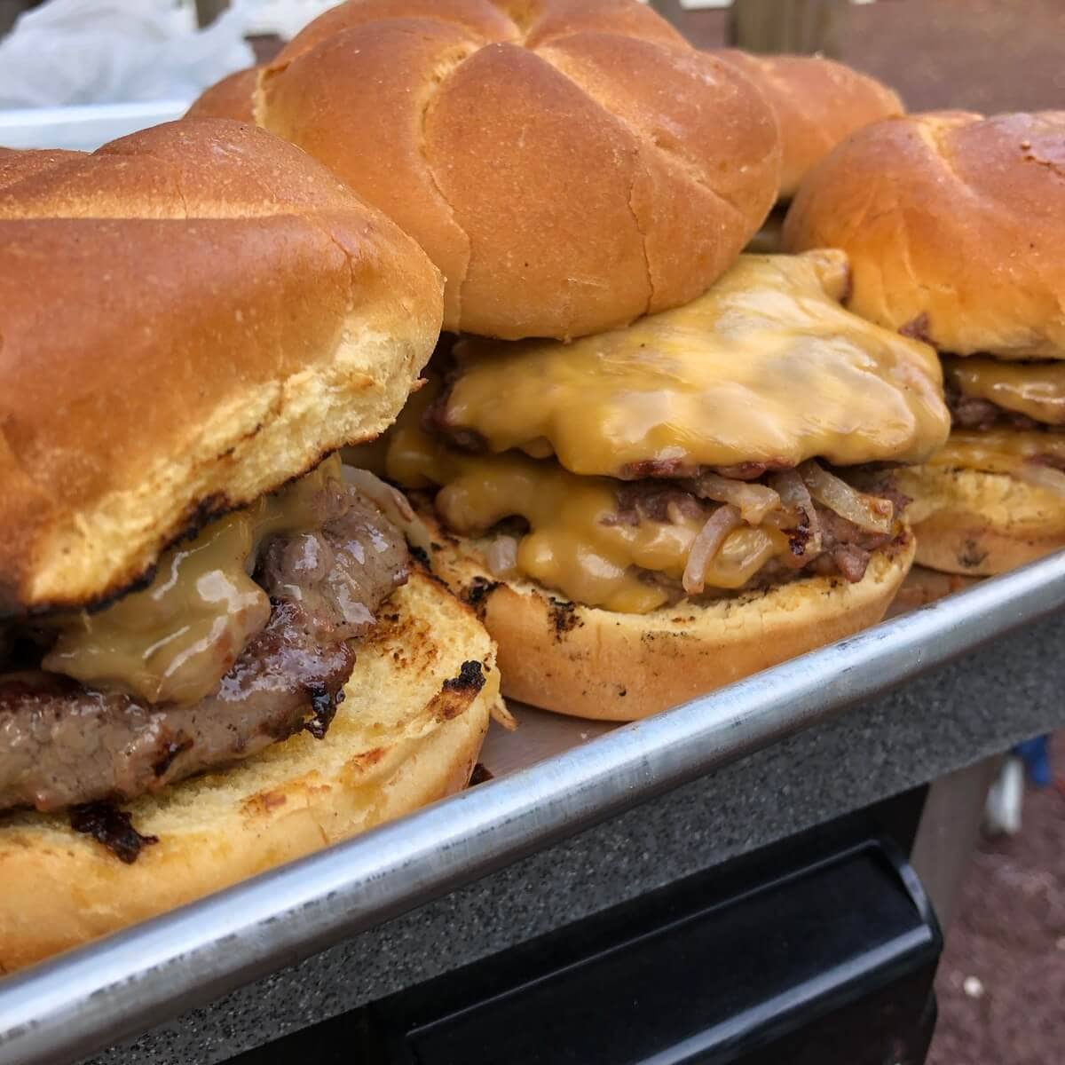 a platter of smash burgers.
