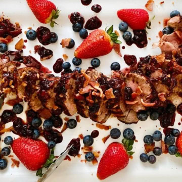grilled pork with blueberries, strawberries and bacon