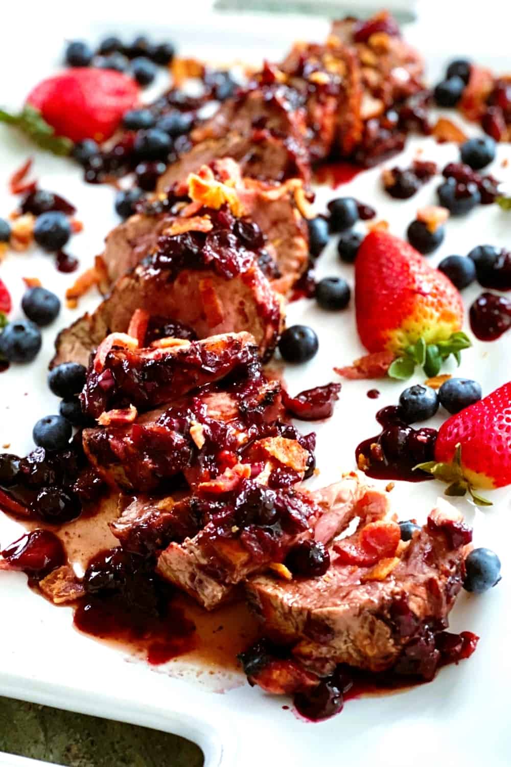 sliced pork with berry bacon sauce