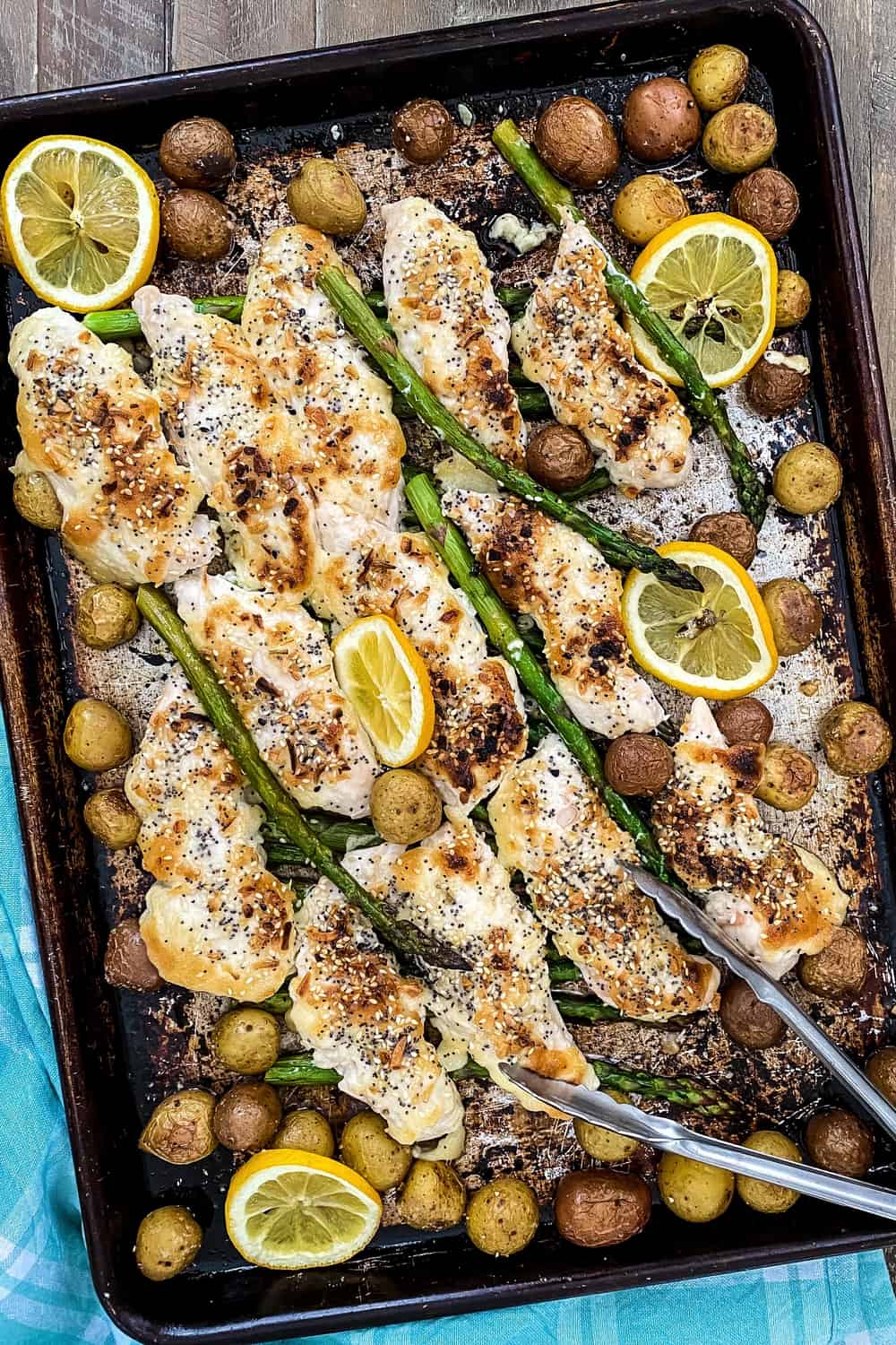 sheet pan dinner with chicken, potatoes, and asparagus with everything bagel seasoning