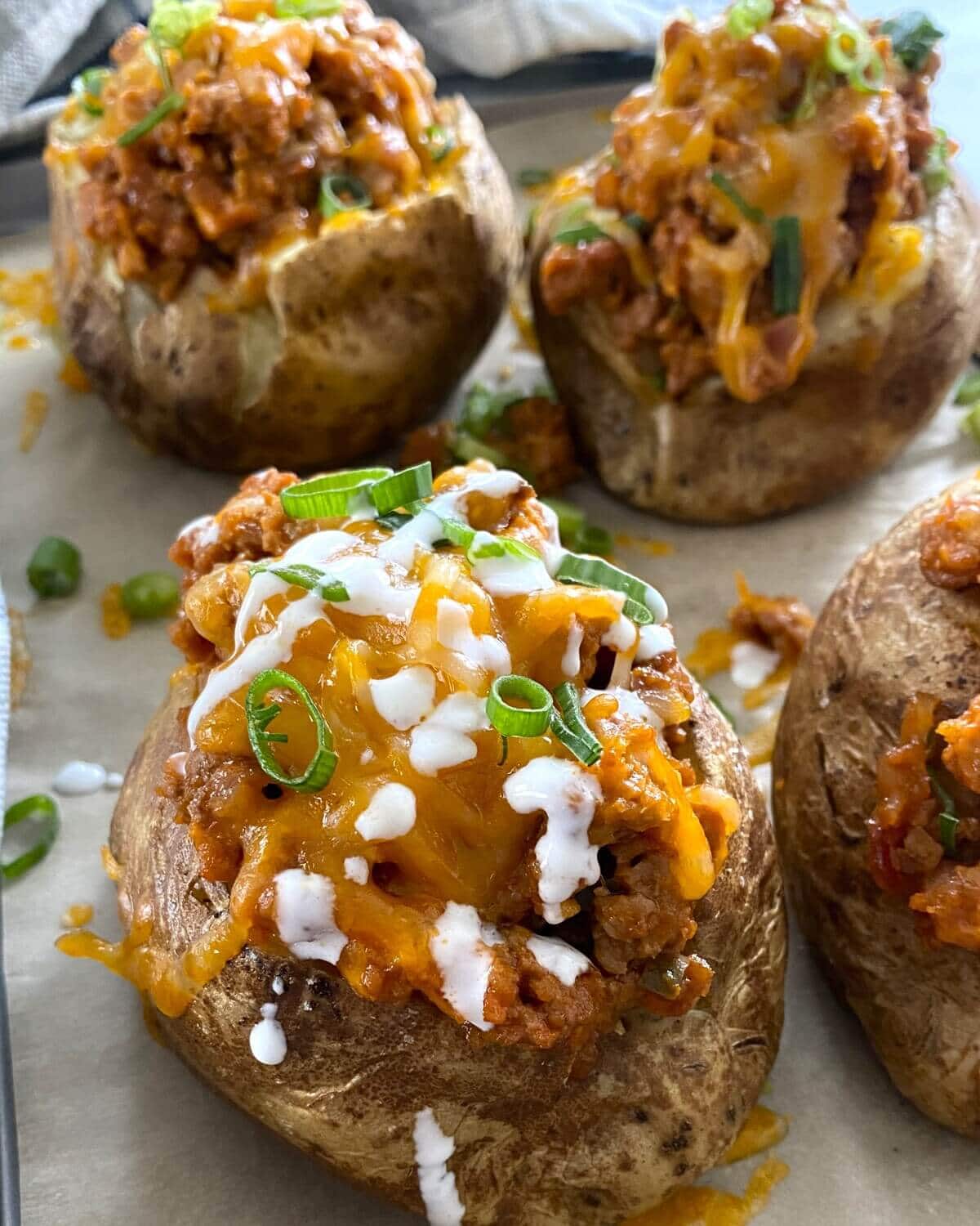 sloppy joe baked potato with melted cheese.