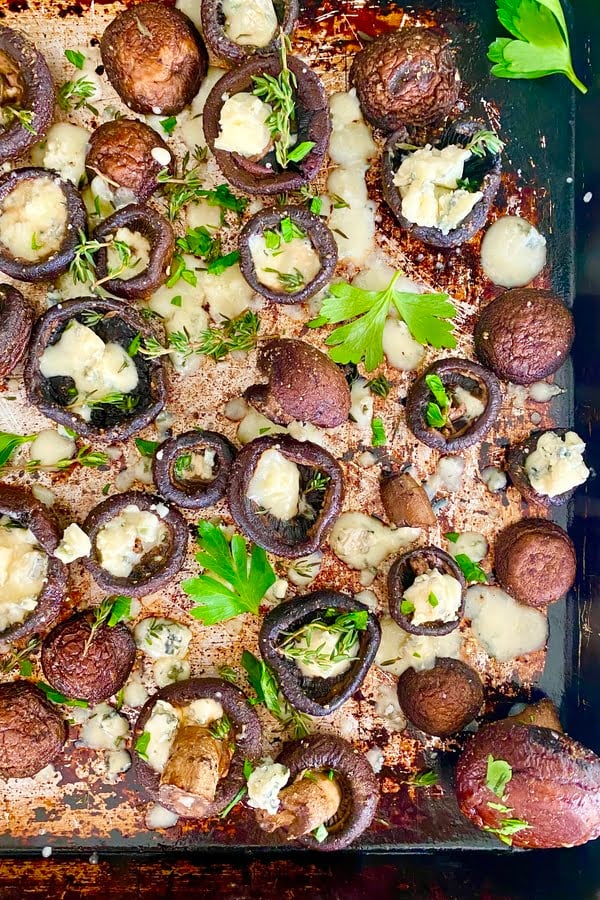 pan of baked mushrooms with butter, garlic and blue cheese