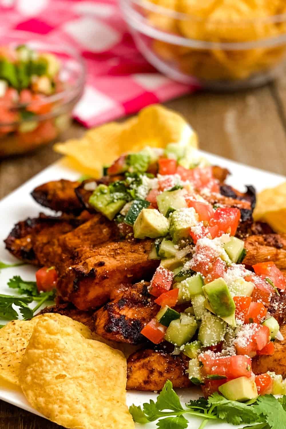 Lime Chili Chicken with Avocado Tomato Salsa. Smoky grilled chili and lime marinated chicken gets a cool topping of a avocado tomato salsa. This one will be a family favorite!
