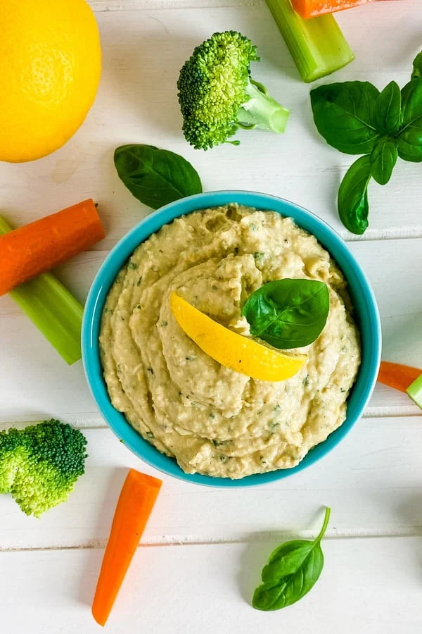 bowl of hummus with cut up veggies