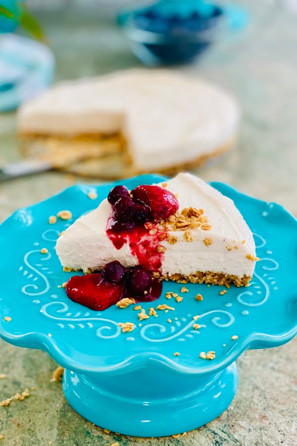 slice of no bake cheesecake with berry topping