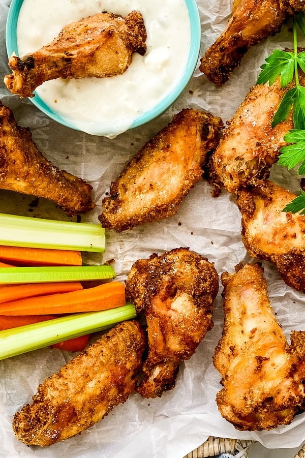 appetizer of poultry with blue cheese dip and celery and carrot sticks