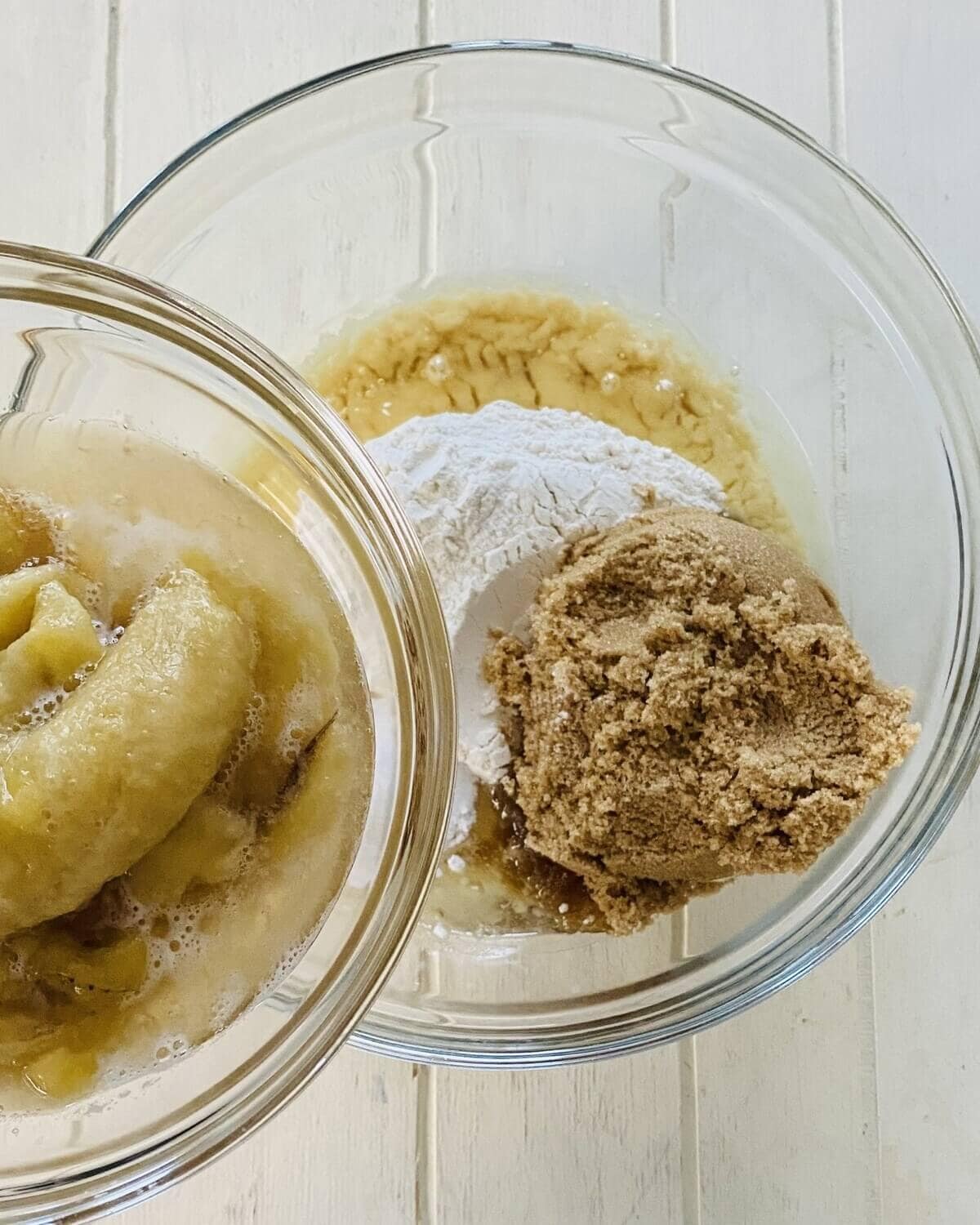 adding banana to flour and brown sugar.
