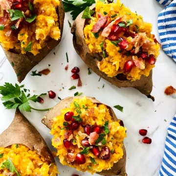 Fall side dish of apple bacon stuffed sweet potatoes.