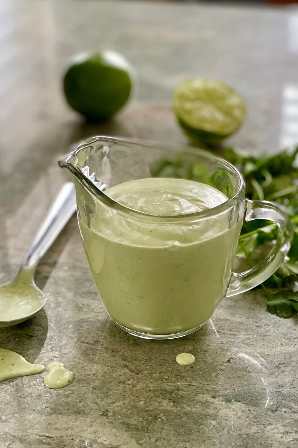 salad dressing in a glass pitcher