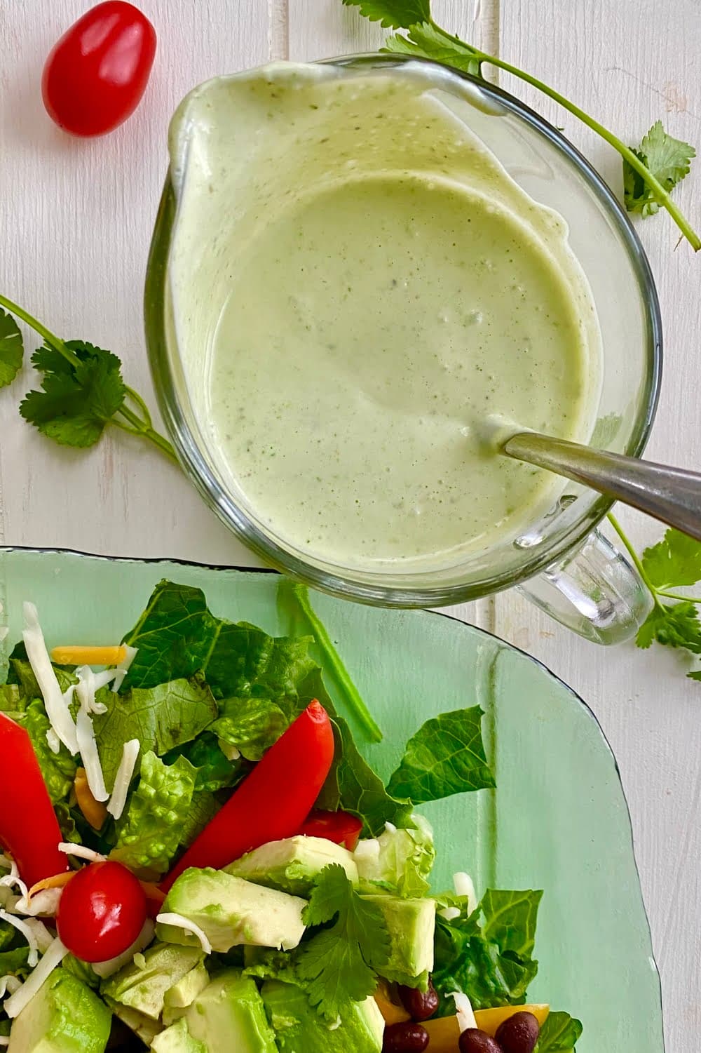 glass pitcher with creamy cilantro lime salad dressing