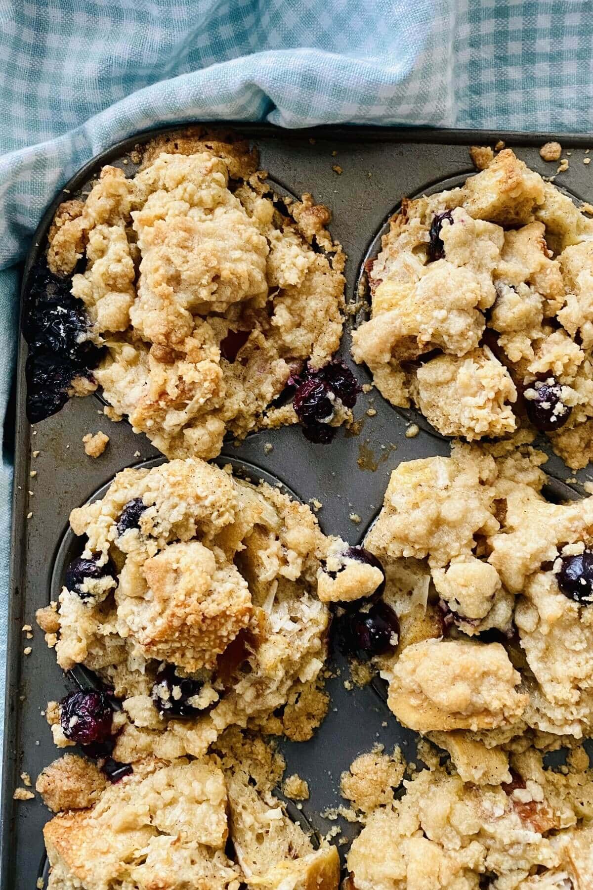 baked French toast muffins in a muffin tin.