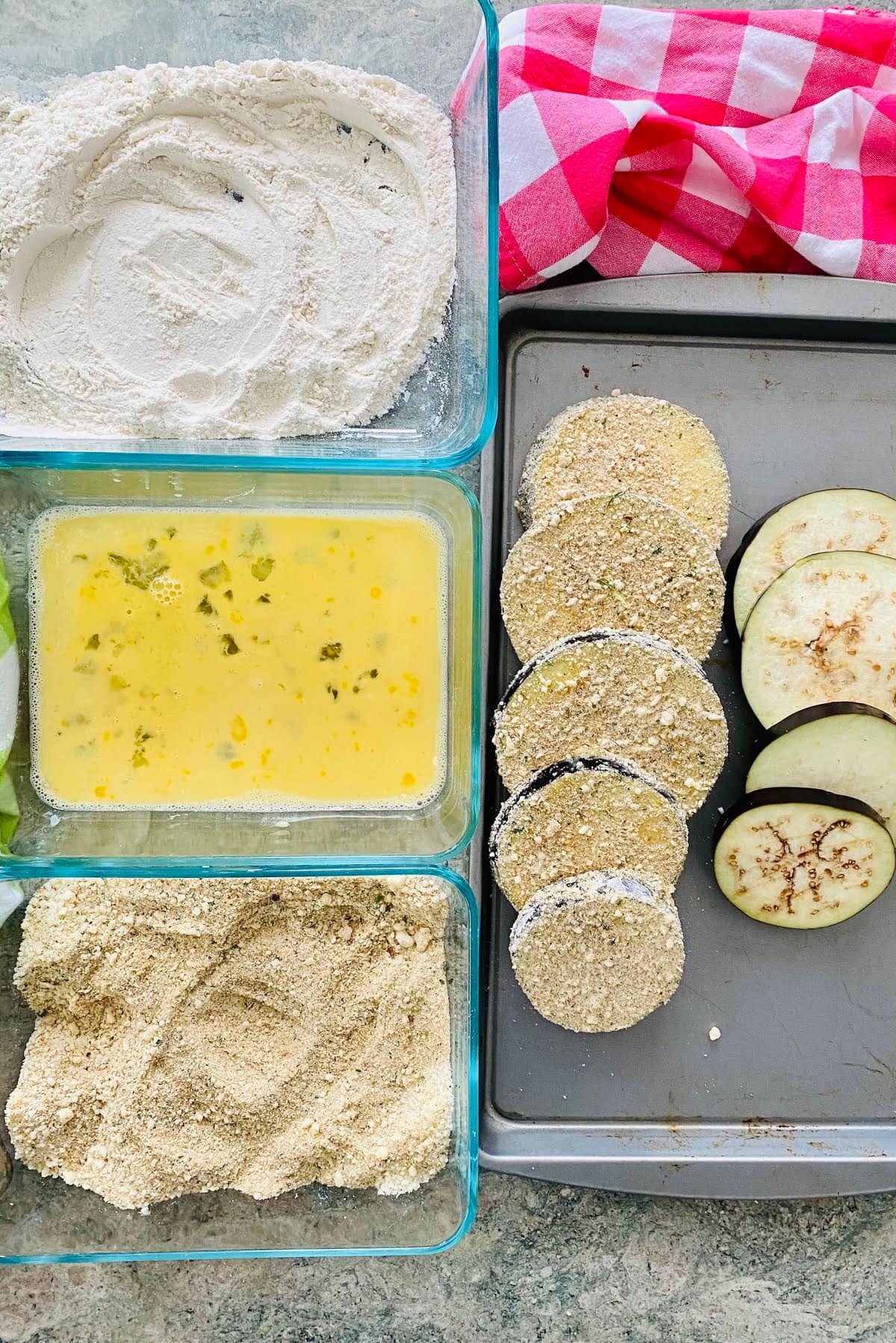 flour, eggs, breadcrumbs and eggplant slices