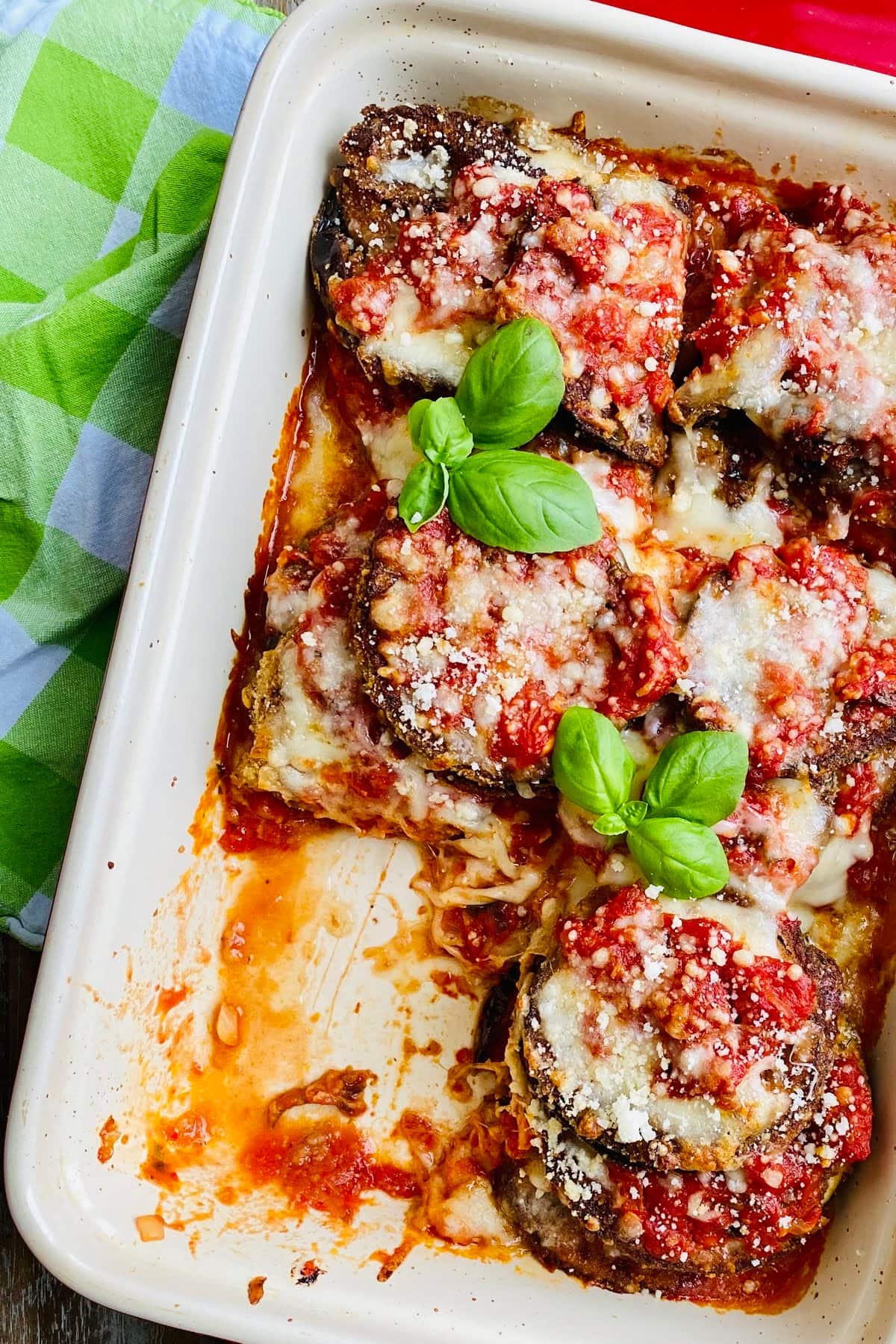 baked eggplant Parmesan with a piece missing