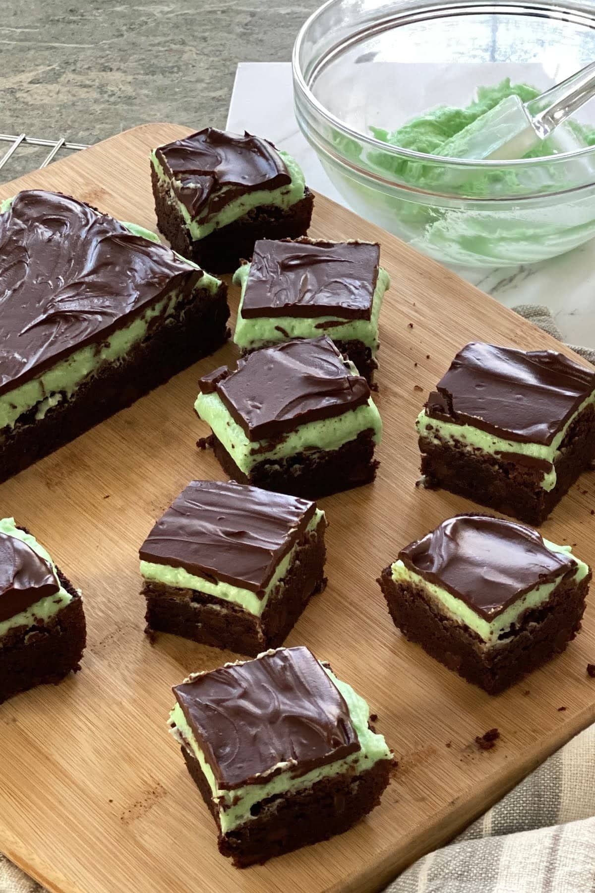 a cutting board with 6 mint brownies