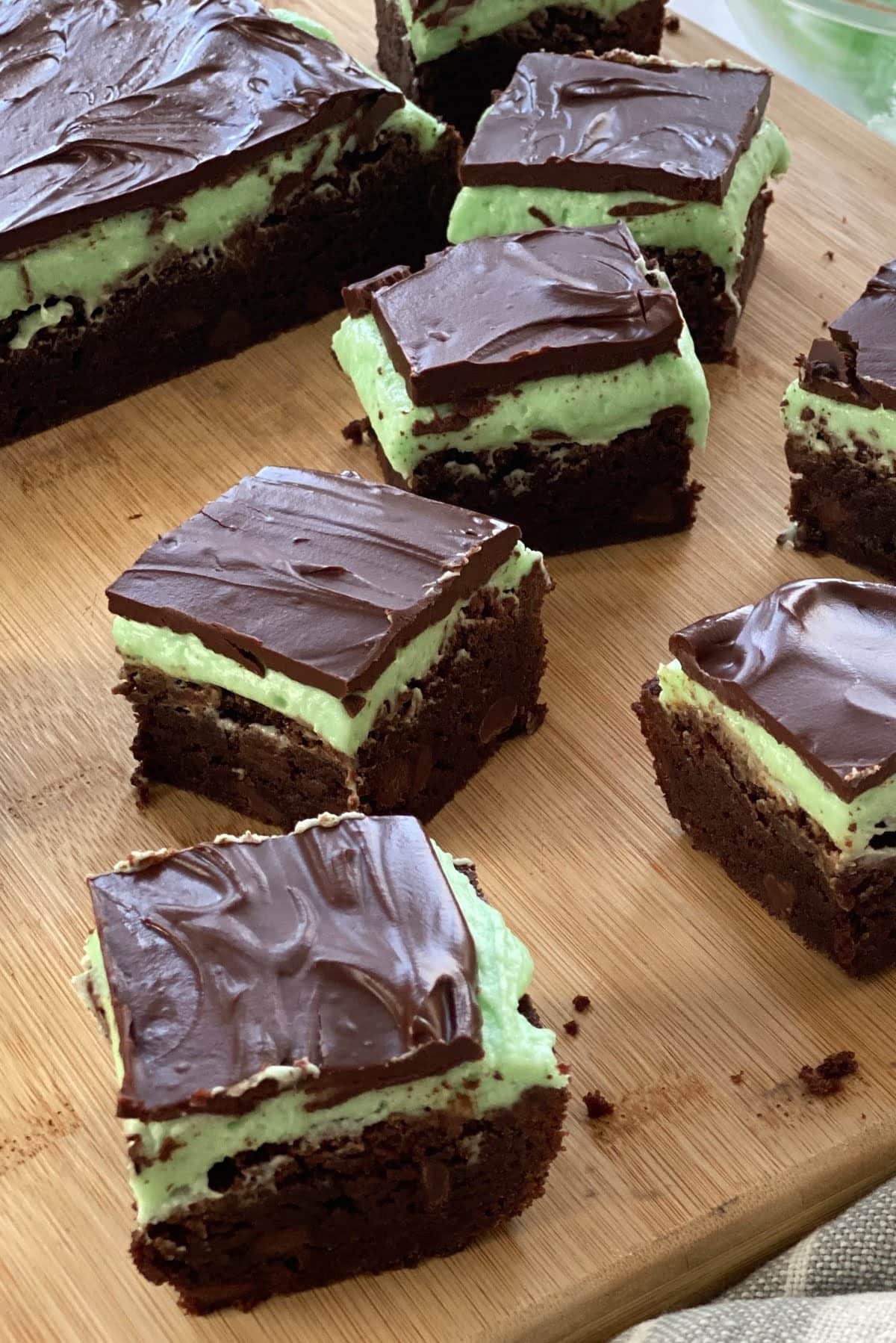 Mint brownies on a cutting board.